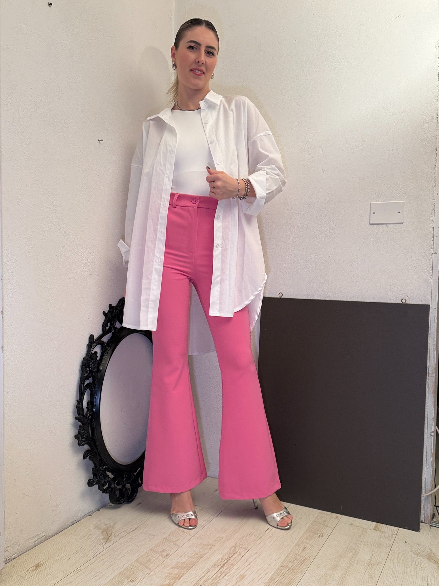 Pantaloni zampa fucsia